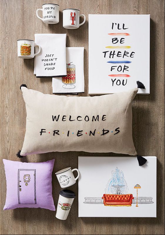 various items are arranged on the floor including pillows, coffee mugs and greeting cards