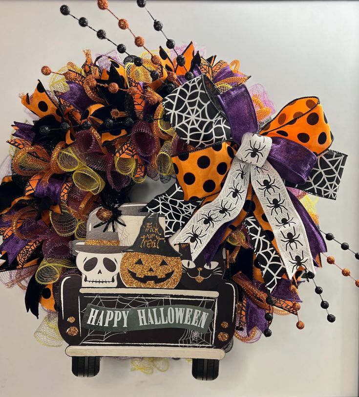 a halloween wreath is hanging on the wall