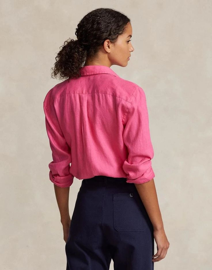 Introducing our 100% Linen Shirt, the ultimate blend of comfort, style, and versatility. Crafted with a classic neckline, long sleeves, and buttoned cuffs, this solid color shirt is a timeless addition to your wardrobe. Whether you're dressing it up for a night out or keeping it casual for a day at the office, the breathable and lightweight linen fabric will keep you feeling cool and comfortable all day long. The button closing adds a touch of sophistication, while the brand logo subtly showcase Fitted Ralph Lauren Long Sleeve Shirt, Solid Color Long Sleeve Shirt With Rolled Sleeves, Ralph Lauren Pink Long Sleeve Tops, Pink Long Sleeve Ralph Lauren Tops, Classic Ralph Lauren Long Sleeve Tops, Casual Pink Top With Lapel Collar, Linen Long Sleeve Shirt With Roll-up Sleeves, Linen Shirt With Roll-up Long Sleeves, Long Sleeve Linen Shirt With Roll-up Sleeves