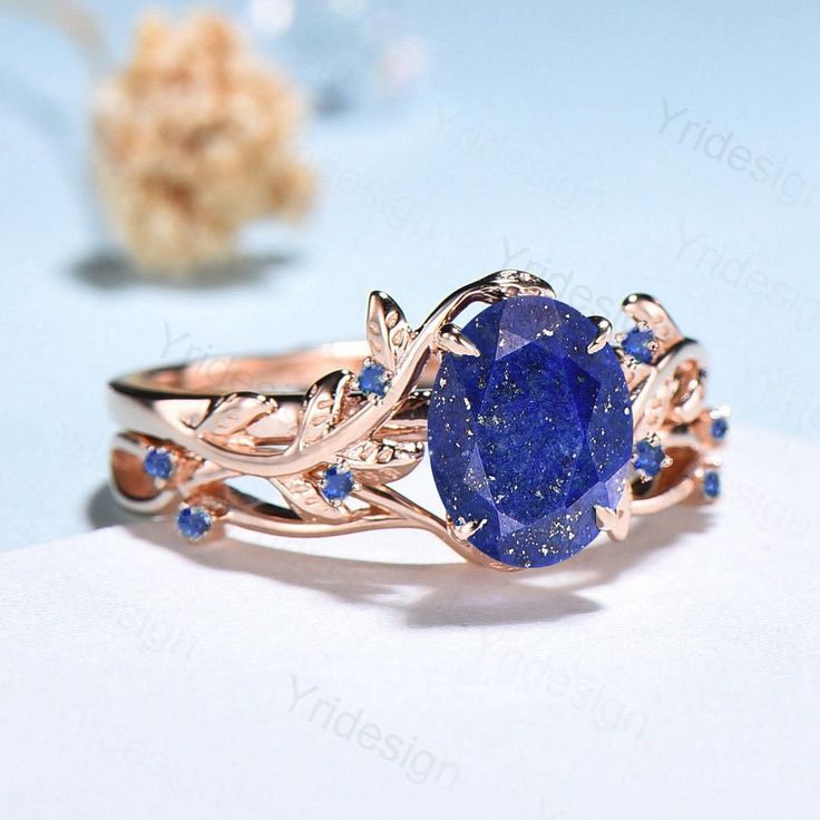 Nature Inspired Lapis Lazuli Wedding Ring Set Elegant Twig Engagement Ring Cluster Sapphire Branch Promise Ring Blue Stone Anniversary Ring ≫≫ Item Details  Make every ring to order, all rings are handmade in the United States.  Metal: Solid 10K & 14K & 18K Gold  Gold Color: Rose gold, Yellow gold, White gold ➽ Center Stone 6x8mm oval cut natural Lapis Lazuli ➽ Accent Stone:lab created blue sapphire Matching band:  lab created blue sapphire Services: Custom Order *The main stone can be other gem Lapis Ring Engagement, Gold Ring With Blue Sapphire, Promise Rings Sapphire, Lapus Lazuli Engagement Ring, Lapis Engagement Ring, Gold And Blue Ring, Lapis Lazuli Wedding Ring, Virgo Engagement Ring, Blue Gem Engagement Ring