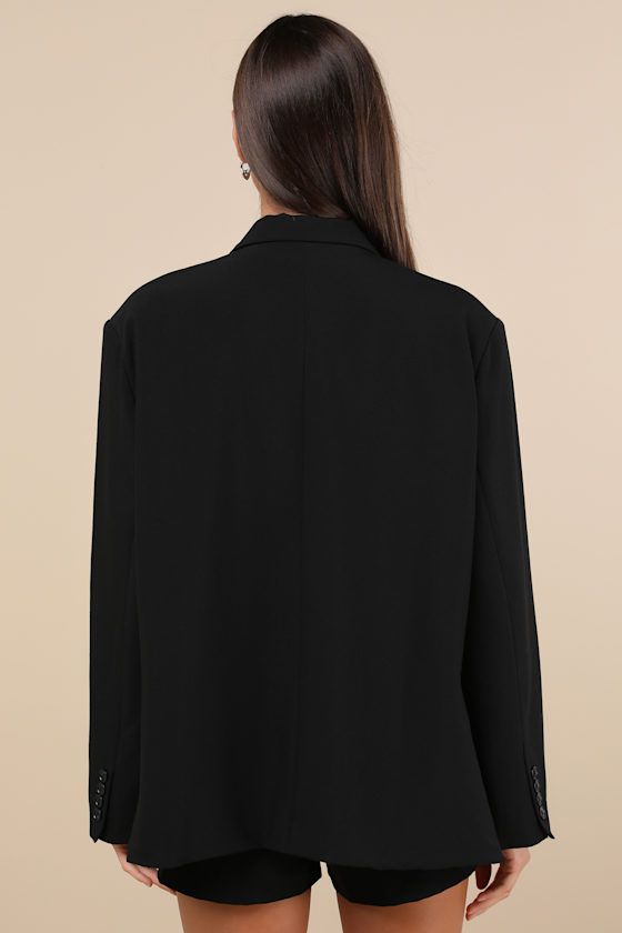 Dress up any look to perfection when you head out in the Lulus Sophisticated Era Black Oversized Blazer! Lightweight woven fabric shapes this versatile blazer with a notched collared neckline and long sleeves with lightly padded shoulders and decorative button cuffs. A faux welt pocket, functional twin flap pockets, and two button closures accent the oversized bodice. Fit: This garment fits true to size. Length: Size medium measures 29.5" from shoulder to hem. Bust: Great for any cup size. Waist Oversized Long Sleeve Blazer For Semi-formal Occasions, Office Blazer With Long Sleeves And Concealed Placket, Oversized Semi-formal Blazer With Lapel Collar, Oversized Chic Collared Blazer, Oversized Collared Chic Blazer, Oversized Blazer With Hidden Button Closure For Office, Single Breasted V-neck Outerwear, Sleek Long Sleeve Blazer With Button Closure, Sleek Long Sleeve Blazer With Hidden Button Closure