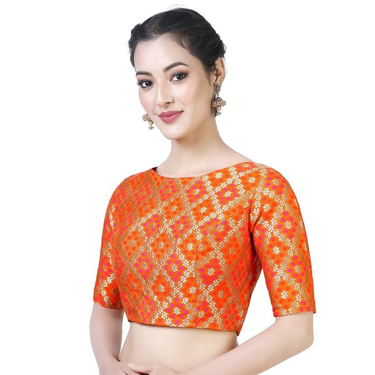 "Beautiful Silk Bandhani Brocade Saree Blouse With Weaving Pattern. Care Instructions: Hand wash seperately Fit Type: Regular This blouse is fully stitched and ready to wear available in many sizes and colours The sleeves are 10.5\" long and the blouse is 15\" in length The fabric used is a very soft bandhni brocade from Benaras This blouse opens from the back with hook and eye and is lined with pure cotton It has a boat neck and ample of margins are provided inside. PRODUCT DETAILS Auction For: Haldi Wear, Designer Saree Blouse, Brocade Saree, India Wedding, Awesome Blouse, Durga Puja, Orange Fabric, Weaving Patterns, Designer Saree