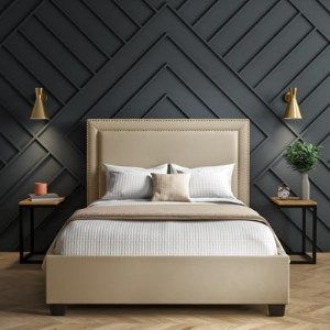 a bedroom with black walls and white bedding in the center, along with two nightstands on either side