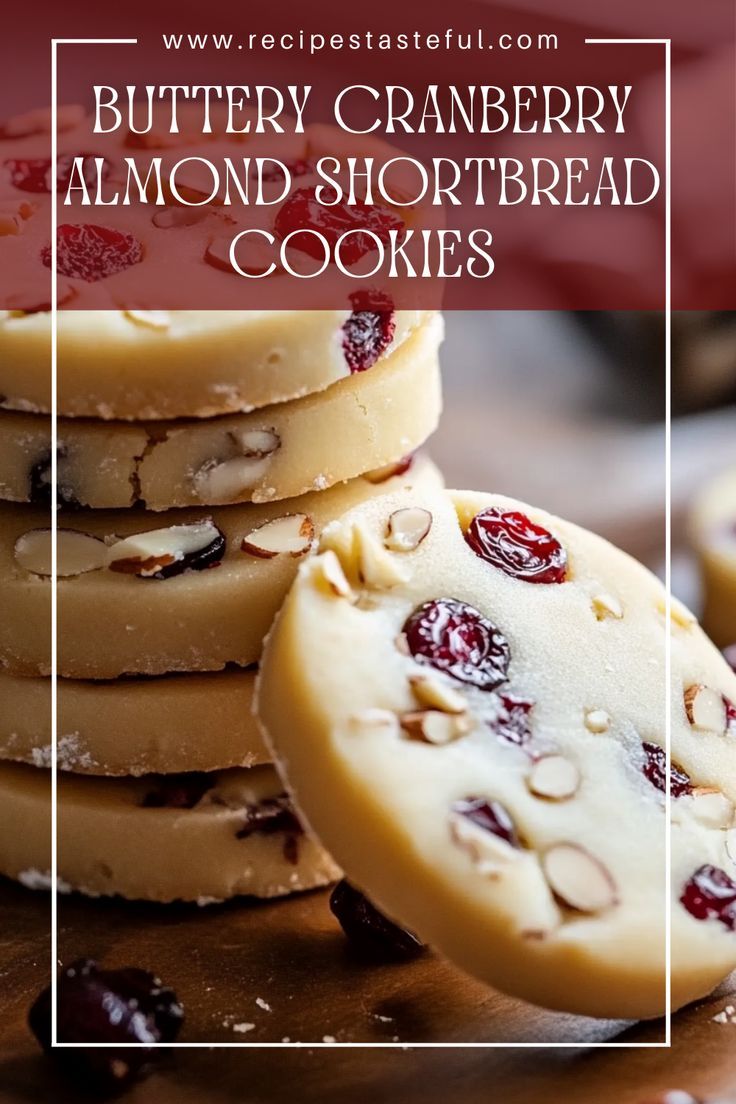 some cookies are stacked on top of each other with cranberry almond shortbread toppings