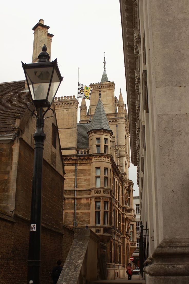 an old street light in front of some buildings