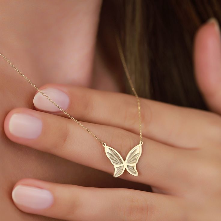 "Meet our elegant 14K Gold Butterfly Necklace, a dazzling piece that effortlessly combines elegance and nature-inspired beauty. This gold butterfly necklace is crafted with precision and attention to detail, making it the perfect accessory for those who value both style and sophistication. PRODUCT ∙ FEATURES: * Material: 14K solid gold provides lasting quality and shine. * Stunning Gold Options: Choose from Yellow gold for a classic touch, Rose gold for a hint of romance, or White gold for timel Luxury Gold Butterfly Necklace Fine Jewelry, Luxury Yellow Gold Elegant Butterfly Necklace, Elegant Butterfly Jewelry As A Gift For Her, Elegant Butterfly Jewelry Gift For Her, Delicate White Gold Butterfly Jewelry, Elegant Yellow Gold Butterfly Necklace, Delicate Butterfly White Gold Jewelry, Elegant 14k Gold Necklace With Butterfly Charm, Elegant Sterling Silver Butterfly Necklace In Yellow Gold