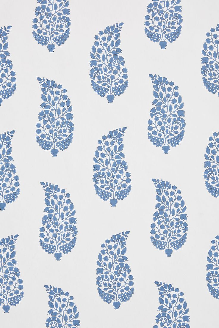 a blue and white wallpaper with leaves on it