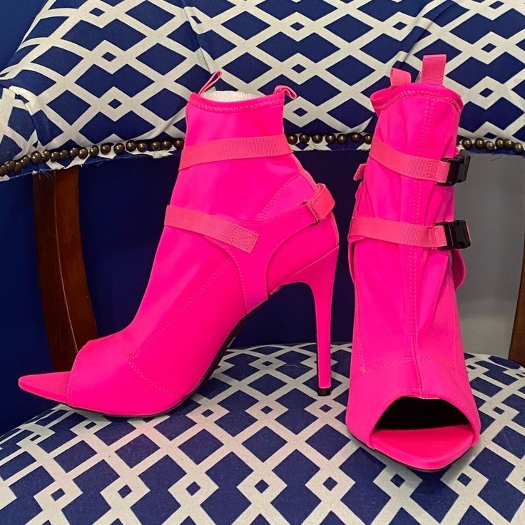 Neon Pink Pointy Peep Toe Ankle Bootie With Strap And Black Buckle Fasteners Across The Ankle. Made Of Stretchy Lycra Scuba Like Material. There Is One Light Spot On The Toe Area Noted In The Picture. Not Clearly Noticeable. Brand New(Tried On Once For Fit) Heel Height Approximately 4” True To Size Spring Party Ankle Strap Booties, High Heel Booties With Padded Ankle For Spring, Pink Ankle Booties For Spring, Spring Ankle-high Heels With Padded Ankle, Ankle-high Heels With Padded Ankle For Spring, Summer Party Booties With Pointed Toe, Spring Ankle-high Booties With Padded Ankle, Spring Party Pink Booties, Party Ankle-high Booties With Padded Ankle