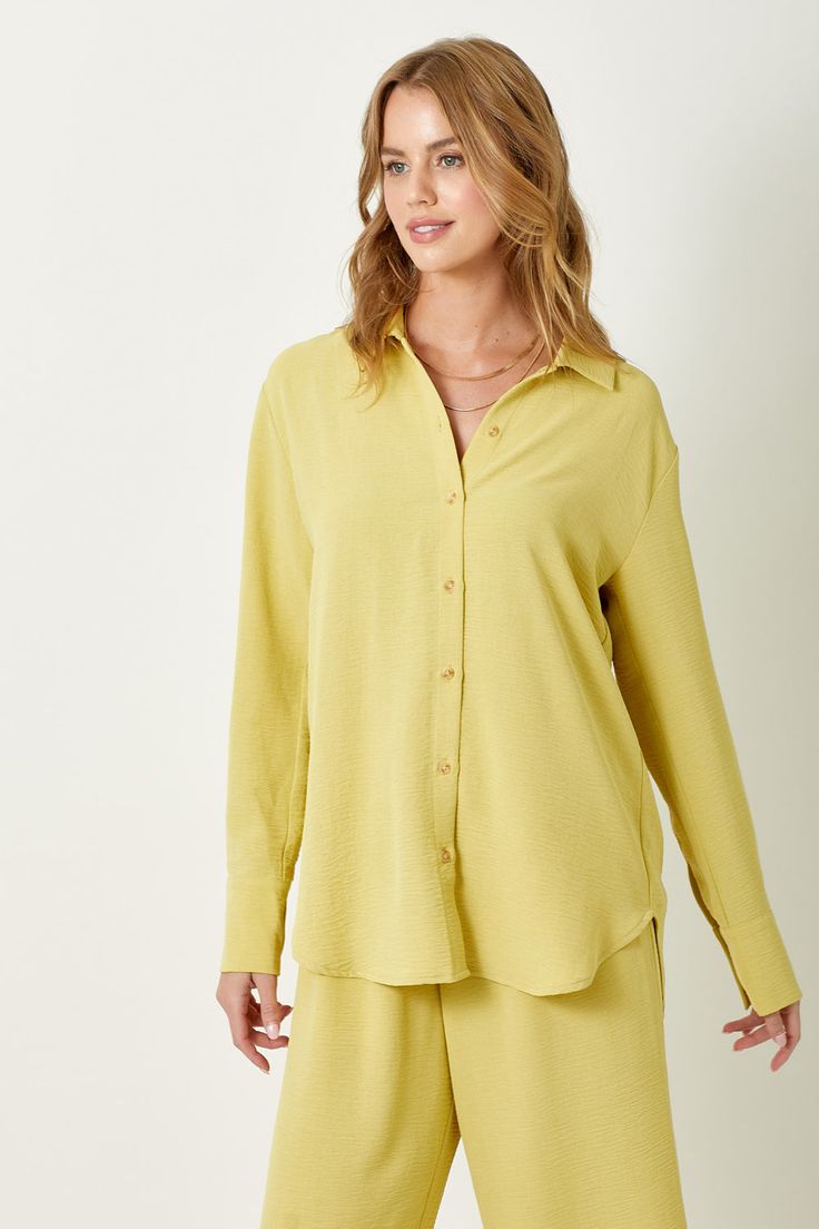 Add a touch of texture to your wardrobe with this playful Muted Lemon Button Down Blouse. With its unique textured design and classic button down style, you'll be a fashion standout. Whether dressing up for the office or dressing down for a day out, this shirt has you covered -100% Polyester -Model wears: S / Model height: 5` 9" Trendy Button-up Blouse For Daywear, Chic Textured Long Sleeve Blouse, Chic Long Sleeve Textured Blouse, Solid Color Button-up Blouse For Day Out, Solid Color Button-up Blouse For Daywear, Trendy Blouse With Button Closure For Daywear, Casual Textured Long Sleeve Blouse, Casual Collared Blouse With Covered Buttons, Solid Button-up Blouse With Placket