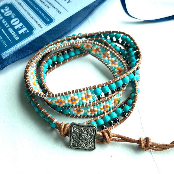 This Beautiful Triple Wrap Is Handcrafted With A Variety Of Small Gemstones, Glass Seed Beads And Genuine Leather. This Limited Edition Style Is A Lightweight And Smaller Version Of Our Traditional Classic Wrap That Offers A More Subtle And Delicate Look. About: 4mm & 6mm Turquoise Stones 2mm Glass Seed Beads 4mm Silver Tone Crystals Natural Genuine Leather 21”-25” In Length With 3 Sizing Options For S/M/L (One Size Fits All) Decorative Metal Button Closure Bohemian Blue Wrap Bracelet With Colorful Beads, Blue Bohemian Wrap Bracelet With Colorful Beads, Blue Bohemian Wrap Bracelet For Festivals, Handmade Blue Hippie Beaded Bracelets, Hippie Blue Bracelets With Round Beads, Hippie Blue Round Bead Bracelets, Blue Hand Wrapped Wrap Bracelet For Festivals, Nickel Free Bohemian Blue Beaded Bracelets, Nickel Free Blue Bohemian Beaded Bracelets