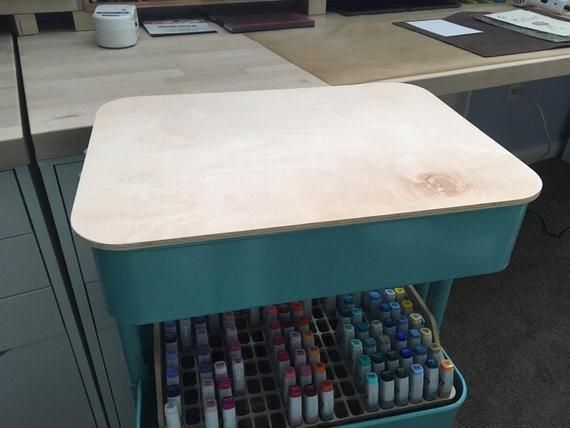 an office desk with lots of paint on it