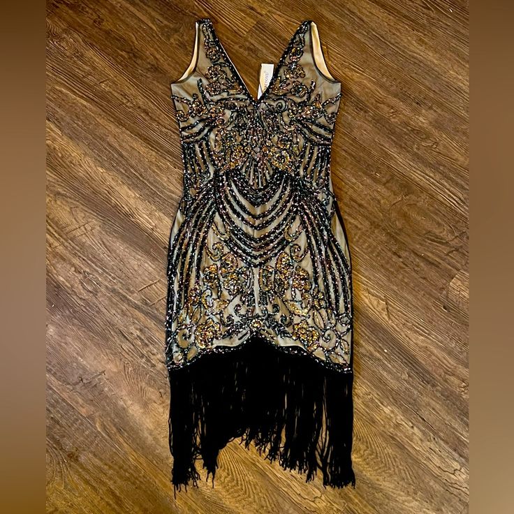 A Beautiful Sequin Party Dress. Nwt Size: Large Form Fitting, Low V Back To Shoulder Blades From Smoke Free Home Dress Has A Nude Liner And Over Black With Multi Color Sequins As Shown In Photos. 1920s Sleeveless Flapper Dress For Costume Party, Black 1920s Flapper Dress For Costume Party, 1920s Style Sequin Party Dress, 1920s Sleeveless Sequin Dress, Black Art Deco Dress For Costume Party, Fitted V-neck Flapper Dress For Party, 1920s Fitted Sequin Dress, Black Flapper Dress For Party, Fitted V-neck Flapper Evening Dress