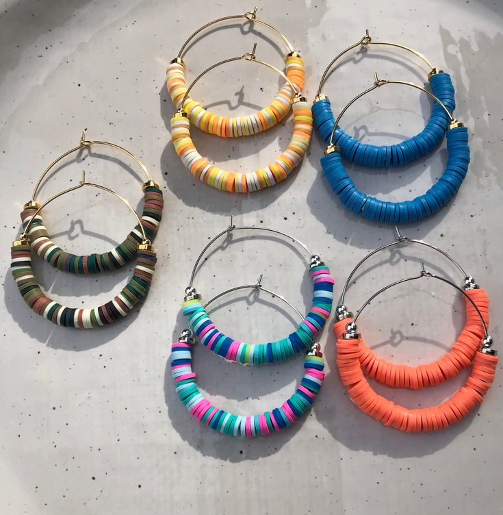 We are a mother daughter team who work together to create each beautiful piece by hand!  These earrings can be made with gold filled hoops or white gold filled hoops.   We love creating these pieces for you ! They are so lightweight and comfortable and are super fun! Nickel-free Heishi Bead Hoop Earrings, Nickel-free Small Hoop Heishi Bead Earrings, Colorful Heishi Bead Jewelry For Fun, Fun Colorful Heishi Beads Jewelry, Colorful Heishi Beads Jewelry, Fun Round Heishi Beads Jewelry, Playful Handmade Hoop Jewelry, Heishi Bead Hoop Earrings, Everyday Multicolor Stacked Jewelry