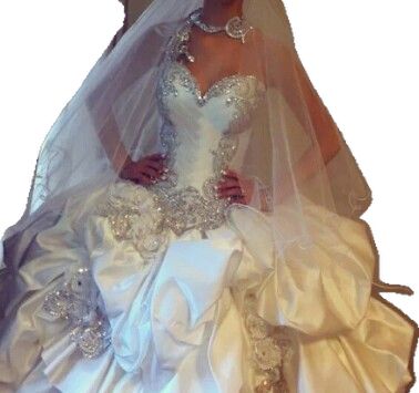 a woman wearing a wedding dress and veil