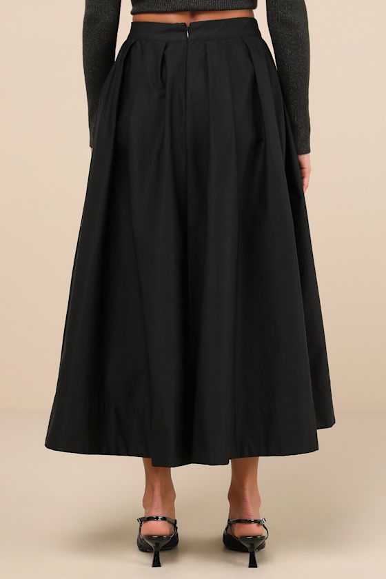 No matter your aesthetic, your looks will always be adorable when you've got the ASTR the Label Katarina Black Pleated Cotton Midi Skirt! Crisp woven cotton shapes this stylishly simple skirt that has a high, banded waist with subtle pleated details throughout. Flaring, lightly structured silhouette ends at a mini hem. Hidden zipper/clasp at back. Fit: This garment fits true to size. Length: Mid-calf length. Size medium measures 34.5" from waist to hem. Waist: Fitted - very fitted at natural wai Asymmetrical Relaxed Skirt For Daywear, Elegant Cotton Pleated Skirt For Spring, Daywear Asymmetrical Pleated Skirt, Black Cotton Maxi Skirt With Elastic Waistband, Black Relaxed Fit Maxi Skirt For Daywear, Voluminous Asymmetrical Pleated Maxi Skirt, Flared Relax-fit Maxi Skirt For Daywear, Relaxed Flared Maxi Skirt For Daywear, Black Lined Maxi Skirt For Daywear