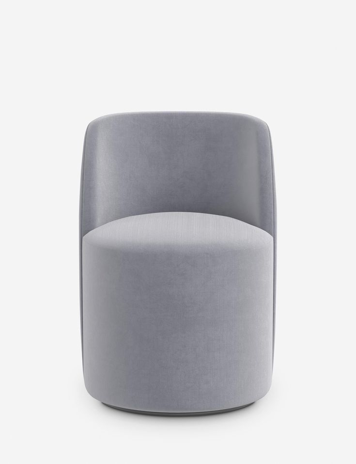 a grey chair sitting on top of a white floor