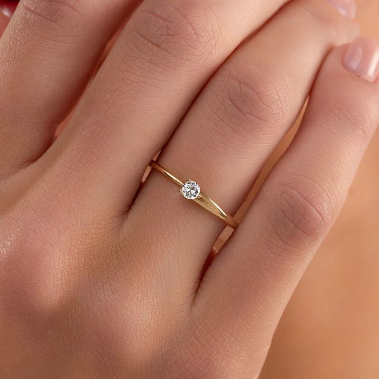 Diamond Solitaire Ring Dainty Engagement Ring, Round Brilliant cut Diamond Ring, Prong Set Solitaire Ring, 14k Solid Gold Ring, Dainty Diamond Ring, Christmas Gift ✧ DESCRIPTION & DETAILS *  Gold Kt: 100% 14k Solid Gold *  Certificate of Authenticity *  Diamond: 3.00mm *  Average Weight: 1.20gr  *  Band Width: 2.90mm to 1.50mm *  Band Heigth: 1.50mm *  Total Carat Weight: 0.10ct *  Diamond's Clarity & Color: SI1 , E-G, Excellent Cut *  Eco-Friendly Packaging  Solid gold pieces are made to last f Dainty 14k Gold Diamond Ring With Tension Setting, Classic Simple Promise Jewelry, Classic Simple Design Jewelry For Promise, Classic Simple Design Promise Jewelry, Modern Stackable Rings For Promise, Classic Birthstone Ring With Tension Setting For Promise, Classic Birthstone Promise Ring With Tension Setting, Modern Stackable Rings With Single Diamond For Promise, Delicate Solitaire Ring With Round Band For Wedding