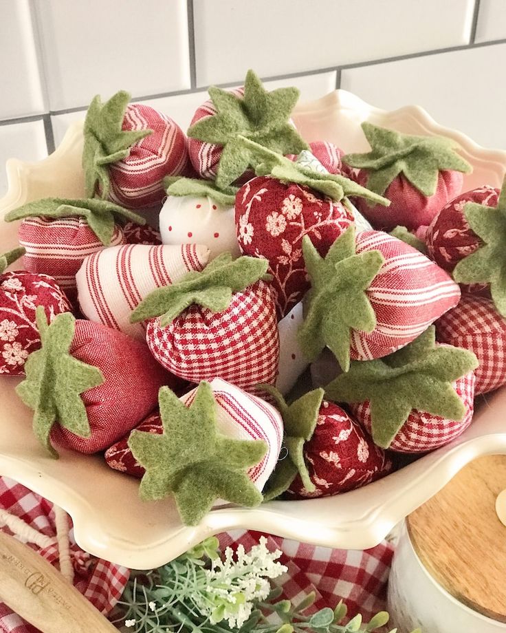 some strawberries are in a bowl on a table