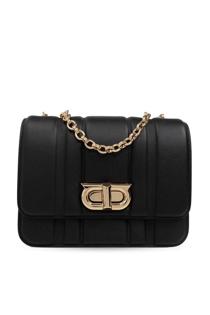 Black shoulder bag from FERRAGAMO. Made of calf leather, this design secures with a logo-shaped twist fastener and features a long chain and leather shoulder strap, one back slip pocket, gold-tone metal hardware and one internal compartment with two slipComposition: Calf Leather Metal Chic Business Shoulder Bag With Gold-tone Logo, Elegant Formal Flap Bag With Logo Hardware, Classic Evening Flap Bag With Logo Hardware, Chic Formal Flap Bag With Logo Hardware, Black Shoulder Bag With Gold-tone Logo For Office, Chic Evening Flap Bag With Logo Hardware, Gold Office Bag With Logo Hardware, Gold Bags With Logo Hardware For Office, Modern Formal Shoulder Bag With Logo Hardware