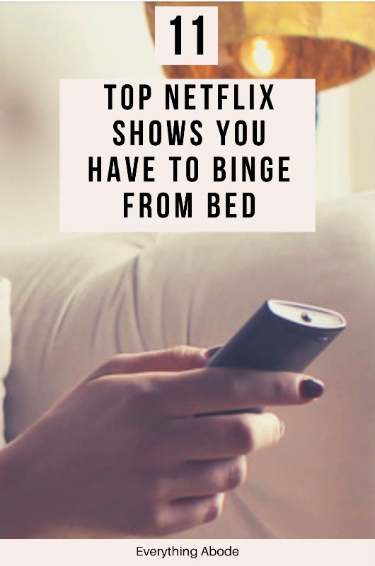 a person holding a cell phone with the text 11 top netflix shows you have to binge from bed