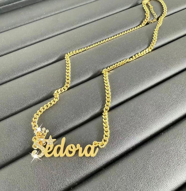 --Bling Gold Name Necklace,Custom Name Necklace,Name Necklace Gold,Cuban Chain Necklace,Name Plate Necklace,Personalized Necklace Women Men The most unique jewelry you can find, a perfect gift for your friend, family, or for yourself.  ❤️ Made and shipped from the USA ❤️ NO FADE / NONTARNISH / WATERPROOF ❤️ High-quality materials and attention to detail ❤️Color: Silver, Gold, Rose Gold ❤️ Our Process time is about 5 - 10 business days upon ordering.         The Transportation time is 4-7 Days. E Personalized Cuban Link Necklaces For Gift, Personalized Cuban Link Necklace As Gift, Personalized Cuban Link Necklace For Gift, Customized Gold Cuban Link Jewelry, Customized Gold Cuban Link Necklaces, Gold Cuban Link Name Necklace, Silver Personalized Name Necklace, Customized Name Necklace Pendant, Personalized Silver Name Necklace With Chain