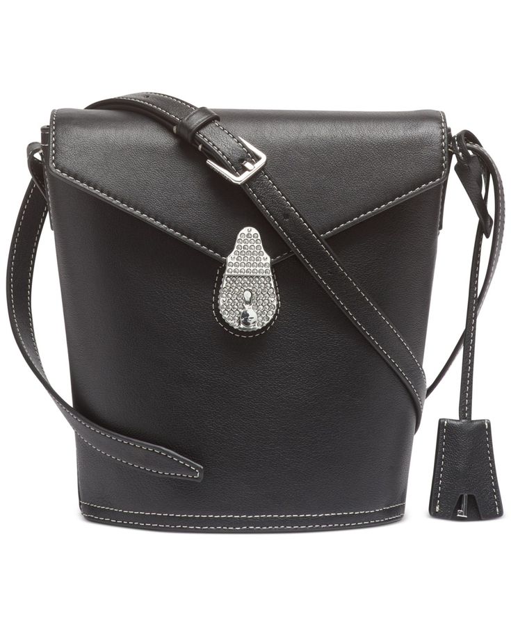 A casual-cool silhouette with statement hardware. Calvin Klein's leather bucket bag is the perfect way to showcase refined, everyday style.
<ul class="">
 	<li>Mini sized bag; 7"W x 10"H x 3"D (width is measured across the bottom of handbag); 1 lbs. approx. weight</li>
 	<li>17"L adjustable strap</li>
 	<li>Lock closure</li>
 	<li>Silver-tone exterior hardware &amp; 1 zip pocket</li>
 	<li>1 interior zi Travel Bucket Bag With Branded Hardware, Modern Bucket Bag With Branded Hardware For Travel, Modern Black Bucket Bag With Branded Hardware, Formal Black Bucket Bag With Metal Hardware, Chic Travel Bucket Bag With Branded Hardware, Leather Crossbody Bucket Bag With Metal Hardware, Workwear Bags With Gold-tone Hardware And Bucket Shape, Leather Crossbody Bucket Bag With Branded Hardware, Bucket Shoulder Bag With Branded Hardware