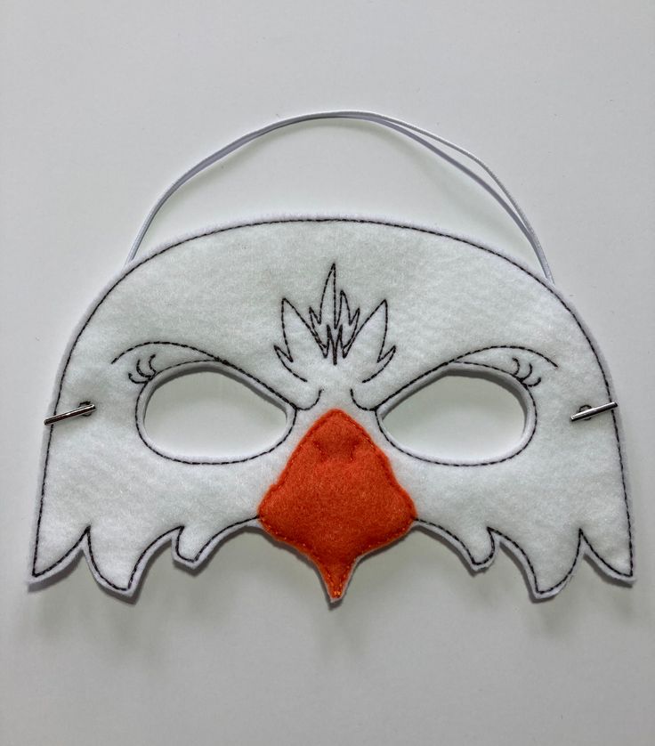 "Eagle Masks. Great for dramatic play/dress-up. Fun mask for Halloween or Cos Play. These masks would make a fun party favor or fun addition to a themed birthday party. You could pair them with your favorite book for a fun gift. Need a larger quantity than what I have listed? Message me. I can usually accommodate larger orders. These masks are made from felt. The details are machine embroidered. The masks include a 13\" elastic strap. This size typically fits from age 3 to small adult. This mask White Novelty Halloween Costume, Carnival And Halloween Costume Mask, White Costume Accessories For Halloween, Novelty Halloween Masks And Prosthetics For Costume Party, Themed White Masks And Prosthetics For Halloween, White Novelty Costume Accessories For Halloween, Themed Carnival Masks, White Masquerade Costume For Halloween, Themed Mask For Carnival Costume Party