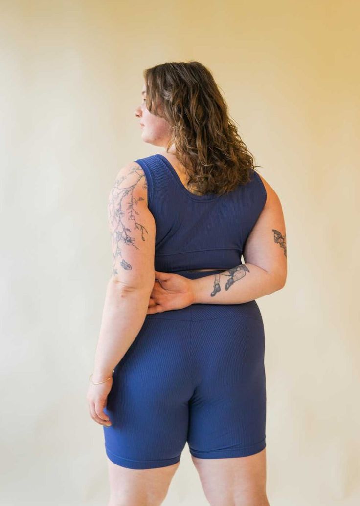 The Bronco Bralette is designed to pair perfectly with our matching shorts and riding leggings. This style provides both bra coverage and light compression, combined with breathability and a sleek look, thanks to our custom-milled sport rib fabric. With minimalist lines and a western-inspired front yoke, we've been loving styling this one as a cropped tank under jackets! Features Light compression Buttery rib fabric Front yoke detail Wide hem band for a comfortable fit Fabric: 85% nylon, 15% elasthane, milled in LA. Machine wash cold, hang to dry. Size chart - Fits true to size for cup sizes B-G. If your cup size is outside of that range, select "custom" size option and we can customize your fit! Proudly Made in our Vancouver Studio Stretch Crop Top For Workout, Fitted Elastane Biker Shorts For Loungewear, Sporty Fitted Crop Top With Built-in Shorts, Versatile Fitted Sports Bra With Seamless Construction, Fitted Bra-friendly Activewear For Pilates, Fitted Seamless Crop Top For Pilates, Fitted Crop Top With Built-in Shorts For Sports, Fitted Seamless Biker Shorts For Pilates, Fitted Short Length Sports Bra For Yoga