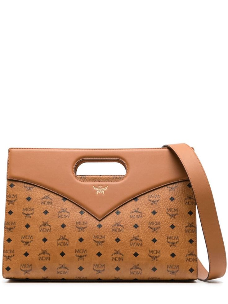 cognac brown leather grained texture signature Visetos print leather trim cut-out top handle adjustable detachable shoulder strap main compartment internal zip-fastening pocket Mcm Clutch, Mcm Tote Bag, Medium Sized Bags, Print Tote, Printed Leather, Printed Tote Bags, Clutch Handbag, Leather Trim, Womens Tote Bags