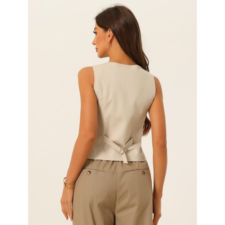 Elevate your summer wardrobe with a fashionable women's vest waistcoat. Its sleeveless design and V-neckline create a chic look that is perfect for any casual or semi-formal occasion. This button-down crop top can be paired with high-waisted jeans, skirts, or shorts to create various stylish outfits. Whether you're going to a music festival or a brunch date, this versatile vest adds a touch of style to your ensemble. A sleeveless vest is the perfect addition to your summer essentials. Stay fashi Elegant Sleeveless Sweater Vest For Spring, Summer V-neck Workwear Vest, V-neck Tank Top For Office In Summer, Spring Office V-neck Tank Top, Beige V-neck Tank Top For Work, Casual Sleeveless Vest For Office, Casual V-neck Vest For Office, Summer Workwear Tank Vest, V-neck Tank Top For Work