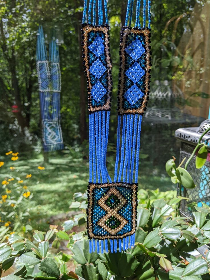 This stunning, collectible, vintage Native American glass bead lariat necklace is hand crafted circa 1940; final photograph shows intentionally misplaced black bead to show that it was hand made. Beads are cornflower blue, white, black, green and in a smaller gauge: solid colored turquoise blue. Possibly made for the tourist industry in the Southwest but beautiful and perfect. Perfect for a collector of Native American Jewelry or someone just feeling the Bohemian spirit, or who appreciates beaut Vintage Collection Adjustable Beaded Jewelry, Vintage Multi-strand Colorful Beaded Necklaces, Vintage Multi-strand Beaded Necklaces With Colorful Beads, Vintage Lariat Jewelry For Festivals, Vintage Multi-strand Beaded Necklace With Colorful Beads, Vintage Lariat Jewelry For Festival, Vintage Adjustable Necklaces With Colorful Beads, Vintage Beaded Chain For Festivals, Vintage Beaded Necklaces With Colorful Beads