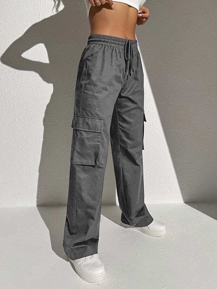 Stay comfortable and stylish with our Casual Flap Pocket Drawstring Waist Cargo Pants. These pants feature a relaxed fit and a drawstring waist that allows for a customizable and comfortable fit. The flap pockets on the sides add a functional and trendy element to the design. Specifications: Type: Cargo Pants Closure Type: Drawstring Waist Details: Drawstring, Pocket Waist Line: Natural Length: Long Fit Type: Regular Fit Fabric: Non-Stretch Material: Fabric Composition: 100% Cotton Care Instruct Casual Wide Leg Cargo Pants With Drawstring, Utility Style Sweatpants With Drawstring And Relaxed Fit, Utility Style Relaxed Fit Sweatpants With Drawstring, Utility Sweatpants With Drawstring For Loungewear, Utility Style Drawstring Sweatpants For Loungewear, Casual Relaxed Fit Cargo Pants With Drawstring, Utility Style Sweatpants With Drawstring, Utility Drawstring Sweatpants For Loungewear, Utility Style Drawstring Pants For Loungewear