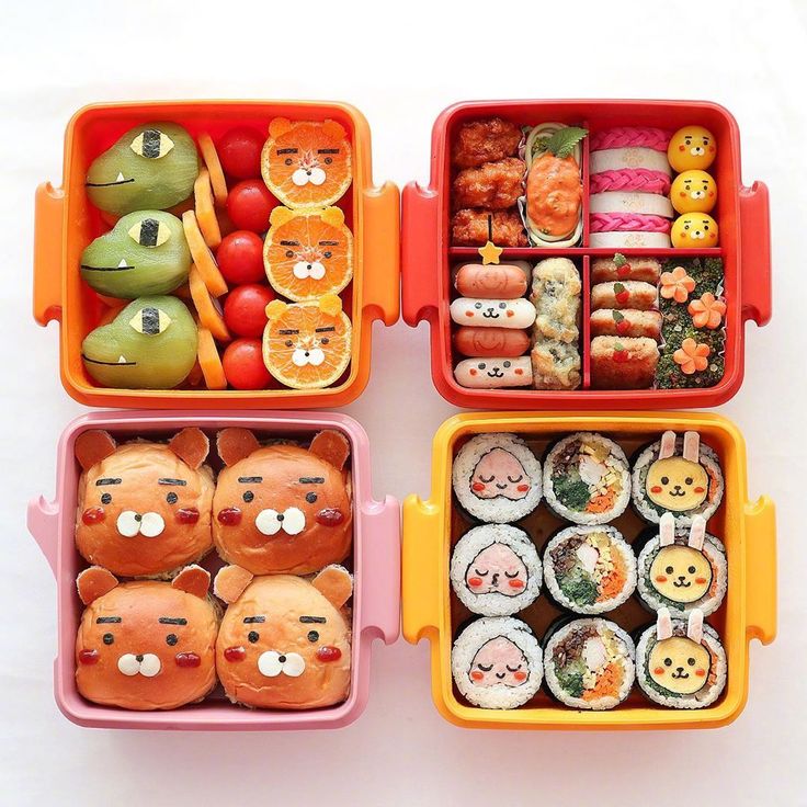 three plastic containers filled with different types of sushi and fruit in each container,