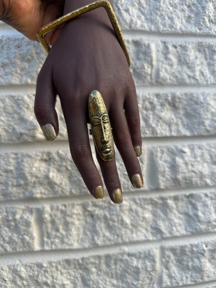 Embrace the heritage and artistry with the African Mask Brass Ring. This striking piece, handcrafted from genuine brass, features a bold, intricately detailed mask design that evokes the rich cultural symbolism of African art. African Rings, African Tribe, Average Joe, Earthy Jewelry, African Mask, Dope Jewelry, African Masks, Jewelry Lookbook, African Jewelry