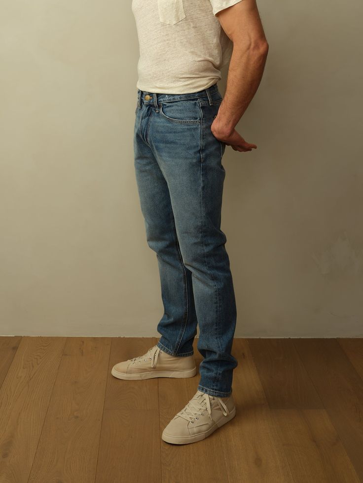 Fit: Mid-rise with a tapered leg. Models are wearing size 31. Fits true to size. Material: 12oz Japanese Denim. 100% BCI Cotton. Eco Brass Buttons. Eco-Wash, using 70% less water. Care: Machine wash cold with like color. Tumble dry low. Do not bleach. Cool ironing. Origin: Made in Los Angeles, CA. Fitted Straight Denim Pants, Fitted Denim Blue Jeans With Standard Cut Leg, Classic Medium Wash Fitted Pants, Classic Fitted Medium Wash Pants, Fitted Classic Medium Wash Pants, Fitted Straight Jeans In Dark Wash, Fitted Dark Wash Bottoms With Straight Hem, Fitted Straight Dark Wash Jeans, Fitted Medium Wash Cropped Jeans