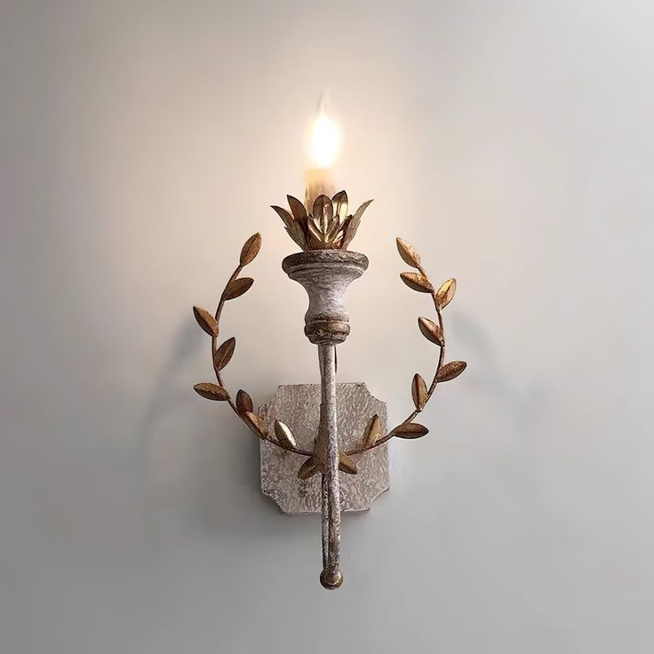 Transform your space into a cozy haven with Cumiers Wall Lamp. Crafted from rustic old white metal, this wall light exudes warm, inviting vibes. With a delicate vine design, it adds a touch of nature to your home. Illuminate your surroundings and create an inviting atmosphere with this beautiful lamp. PRODUCT NOTES D 22cm x W 18cm x H 35cm / ∅ 8.7″ x W 7.1″ x H 13.8″. Old white, Gold. SKU: RDW-155918 MATERIALS Wooden body, Metal arms. E14 socket. (Not included bulbs) SPEC SHEET French Country Lamps, Wood Wall Lamp, Wall Lamp Living Room, Cottage Details, Wood Wall Lamps, Vintage Sconces, Wall Lamps Living Room, Lamp Living Room, Spec Sheet