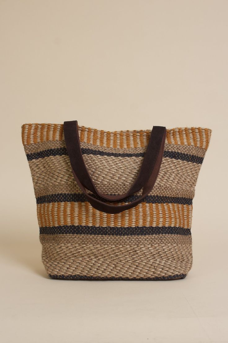 Brand: Lovestitch The Jute Tote is the perfect accessory for a stroll through the market, or a day at the beach. Large enough to carry groceries, beach essentials, or pack for a weekend getaway. Crafted from jute material, it features multiple interior pockets, a magnetic snap closure, and leather/canvas straps for a durable and stylish finish. ♡ Details Color: Natural/Mustard Lined inside Zipper pocket | 2 additional inside open pockets Magnetic snap closure Partial suede leather contrast handl Natural Straw Tote Bag For On-the-go, Brown Straw Shoulder Bag For On-the-go, Brown Bucket Bag With Canvas Lining For Daily Use, Jute Bucket Bag With Adjustable Strap For Everyday Use, On-the-go Natural Bucket Bag With Leather Handles, Brown Rectangular Bucket Bag With Canvas Lining, Brown Canvas Hobo Bag With Canvas Lining, Brown Hobo Bag With Canvas Lining For Everyday Use, Brown Canvas Bucket Bag With Adjustable Strap