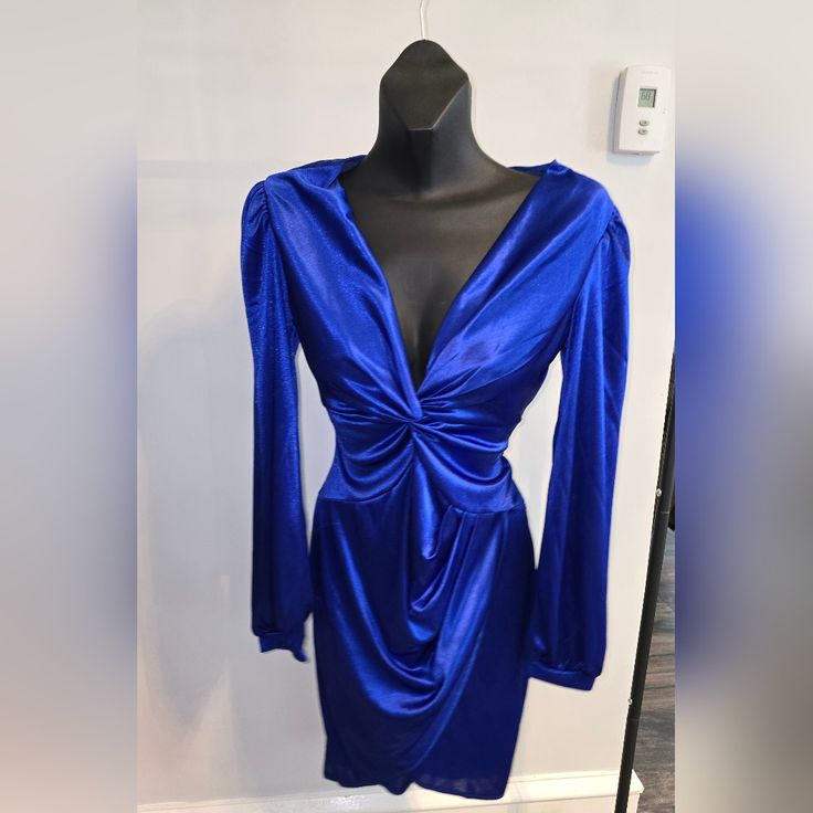 Nwot Medium Blue Satin Long Sleeve Very Low Cut Polyester/Spandex Great Price Glamorous Blue Stretch Bodycon Dress, Blue Stretch Mini Dress For Party, Stretch Blue Mini Dress For Party, Royal Blue Bodycon Dress For Party, Royal Blue Bodycon Dress For Night Out, Glamorous Blue Bodycon Cocktail Dress, Glamorous Blue Cocktail Bodycon Dress, Blue Bodycon Mini Dress For Party, Blue Bodycon Dress For Cocktail Party