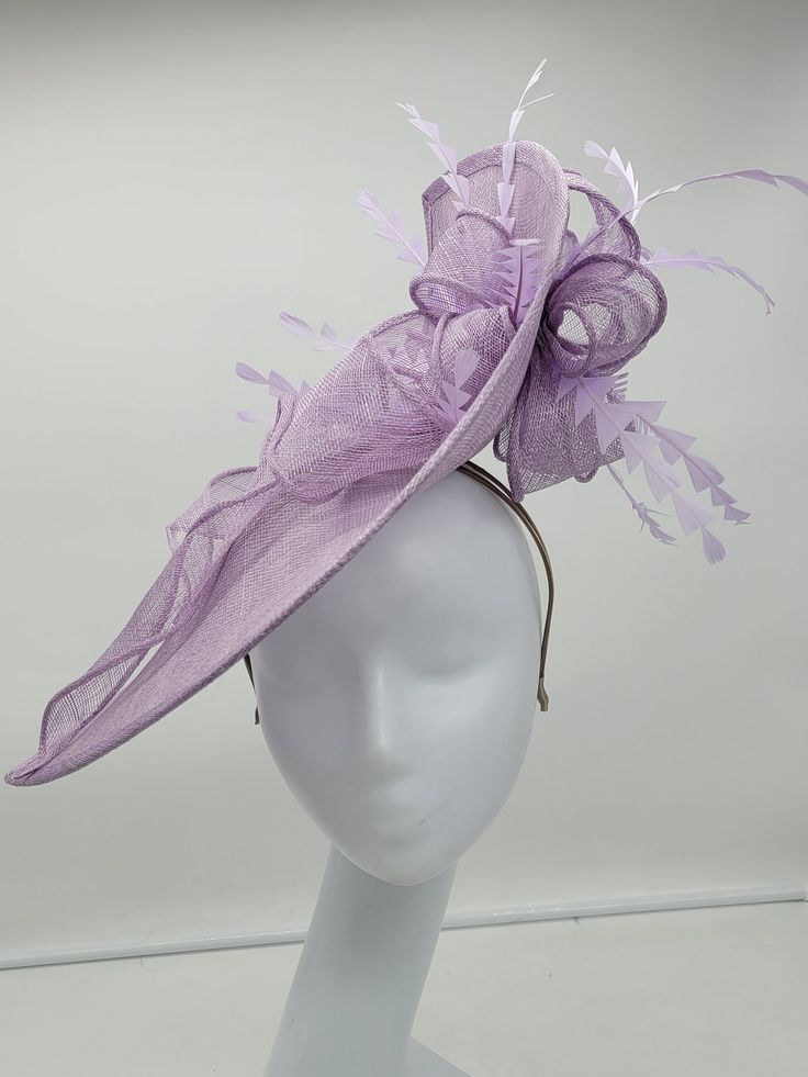 Beautiful lavender stiffened sinamay Fascinator. This vibrant colors will add elegance to any,  bridesmaid,  rehearsal dinner,  Wedding guest,  cocktail party, or church - Ready to ship  - Lightweight - Free Shipping - Fast shipping - Customize by adding different color flowers and or feathers Check my store for styles and colors.  Hatsandpearls.etsy.com Find more at my website: Www.hatsandpearls.com  Reach out to me if you can't find what you are looking for.  I can make cake custom orders and help you style and match your outfit  Tag and share your pictures when you wear and style our hats.  Instagram: @hats_pearls Facebook: Hats Pearls Thank you for visiting and happy shopping! Luxury Purple Feathered Fascinator, Fitted Headpiece For Church And Royal Ascot, Adjustable Elegant Fascinator For Church, Elegant Adjustable Fascinator For Church, Fitted Fascinator For Royal Ascot And Formal Occasions, Fitted Fascinator For Royal Ascot, Spring Party Sinamay Headpiece, Spring Party Headpieces In Sinamay, Lavender Fitted Hat With Curved Brim