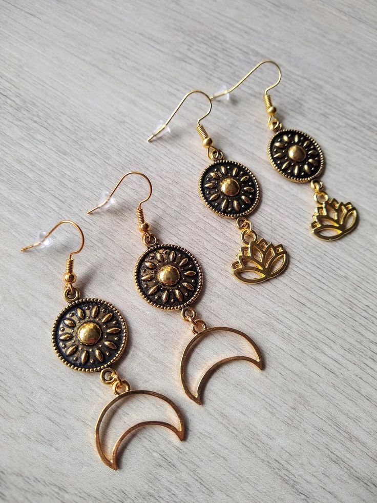 ❤ INFORMATION ❤  These beautiful minimalist earrings with golden coin mandala spacers and a gold crescent moon or lotus charm have golden plated hooks. The total length of the earring is 5,8-6.1 cm. The earrings are a nice colorful addition to any outfit, for a cheerful look for yourself or as an original gift for someone else! Sold per pair and you will receive the earring stoppers.  ❤ CARE ❤  I do not recommend swimming or showering with your jewelry on. When cleaning sterling silver jewelry, Adjustable Bohemian Jewelry With Sun And Moon Design, Festival Crescent Jewelry With Sun And Moon Design, Crescent Sun And Moon Festival Jewelry, Festival Crescent Sun And Moon Jewelry, Nickel Free Moon Shaped Jewelry For Festival, Celestial Nickel-free Jewelry For Festivals, Celestial Style Nickel-free Jewelry For Festivals, Gold Moon-shaped Festival Jewelry, Adjustable Metal Sun And Moon Jewelry