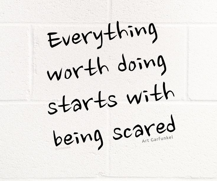 a white brick wall with the words everything worth doing starts with being scared