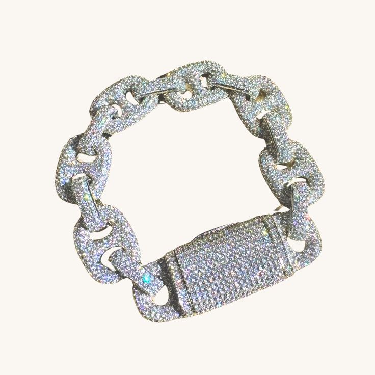 Introducing our stunning Silver Icy Bold Link Diamond Bracelet, the epitome of elegance and luxury. Crafted to make a bold statement, this exquisite piece features high-quality simulated diamonds set in icy silver, radiating brilliance and sophistication. Elevate any ensemble with this dazzling bracelet, perfect for those who appreciate fine craftsmanship and undeniable beauty. Make a lasting impression with this striking accessory that effortlessly exudes glamour and style. ✔Hypoallergenic ✔Quality Guaranteed COLOR: silver LENGTH: 7 inches MATERIAL: rhodium plated, simulated diamonds Luxury Silver Diamond Bracelet With Complimentary Chain, Luxury Metal Bracelet With Sparkling Stones, Luxury Metal Bracelets With Sparkling Stones, Luxury Sparkling Bangle Bracelets, Luxury Sparkling Bangle Bracelet, Luxury Sparkling Diamond Bracelet, Dazzling Crystal Bracelet, Luxury Sparkling Bracelets For Formal Occasions, Luxury Sparkling Bracelet For Formal Occasions