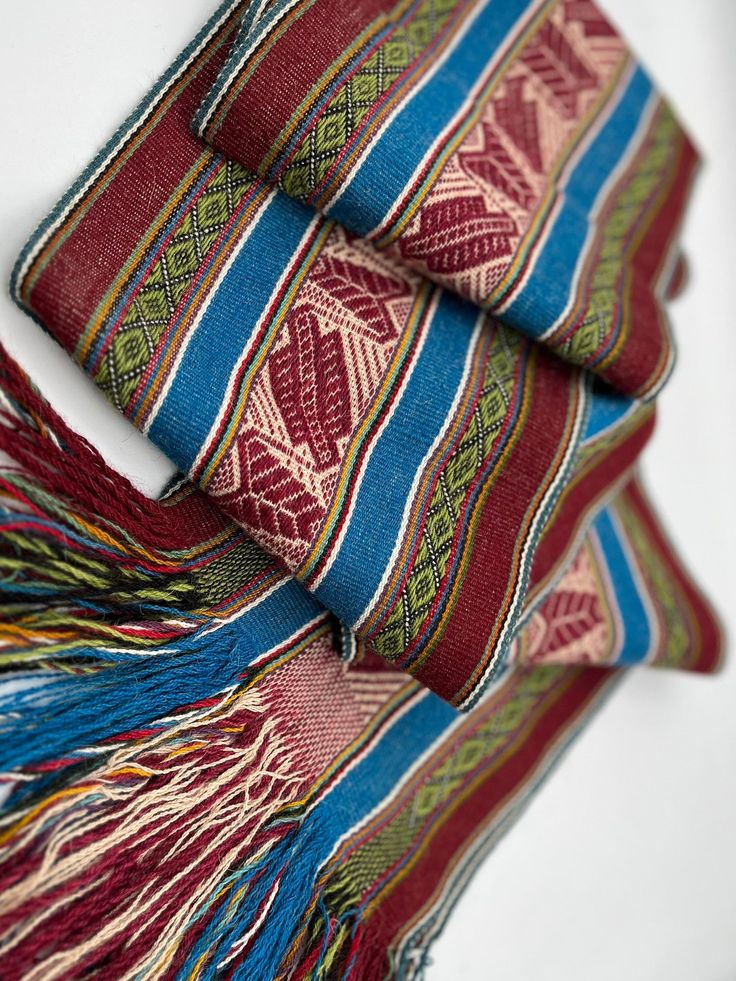 "This beautiful unisex Alpaca wool scarf naturally dyed is handwoven by Quechua artisans living in the Sacred Valley of the Inka's in the Peruvian Andes (Cusco), where they mantain their ancestral knowledge of plants and weaving. It is handmade with 100% adult alpaca in their genuine colors. It has a RUSTIC look with geometric design. The Traditional Andean geometric figures span this long alpaca scarf in earthy desert hues. Finished with twisted fringe.  This beautiful scarf is a perfect cozy gift for your love one.  Features: * Made from 100% Baby ALPACA in their natural colors. Measurements: 74\" long by 7.5\" wide,  Fringe = 6\" Dry clean or hand wash gently in cold water with mild detergent - dry flat - no machine dryer" Handwoven Folk Shawl One Size, Folk Style Handwoven Shawl, Handmade Alpaca Bohemian Shawl, Handmade Bohemian Alpaca Shawl, Traditional Woven Winter Shawl, One Size Handwoven Alpaca Shawl, Bohemian Shawl Scarf With Natural Dye, Bohemian Shawl Scarves With Natural Dye, Traditional Alpaca Shawl One Size