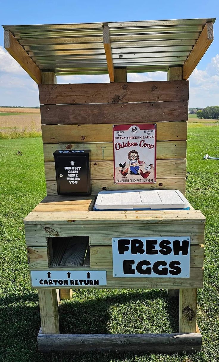 an outdoor chicken coop made out of pallet wood with fresh eggs on the side