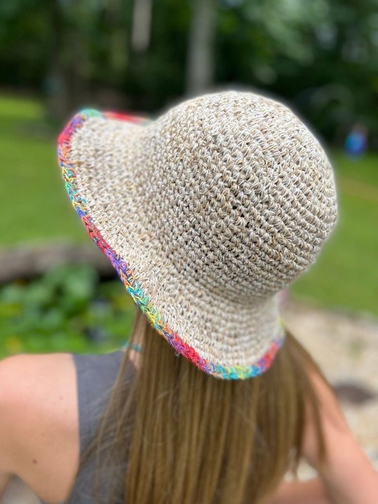 "Organic Hemp Crochet Sun Hat - Multi-Color, Rainbow Our 100% handmade crocheted sun hats are made from pure hemp yarn from Nepal. Perfect for summer...at the beach, pool, festival or just hanging around. They come in one size which fits most! As with many 100% hemp products they maybe slightly stiff, but soften and stretch over time. Features: - 100% Hemp hat and handmade in Nepal - It has wire in the rim means you can shape the hat however you desire and flat pack it for easy storage or travel Adjustable Multicolor Crochet Straw Hat, Adjustable Crochet Hat With Flat Brim, Adjustable Multicolor Straw Crochet Hat, Knitted Beach Hat Made Of Yarn, Adjustable Woven Crochet Hat Made Of Yarn, Adjustable Woven Crochet Hat, Adjustable Woven Yarn Crochet Hat, Adjustable Cotton Yarn Crochet Hat With Curved Brim, Adjustable Crochet Hat With Curved Brim In Cotton Yarn