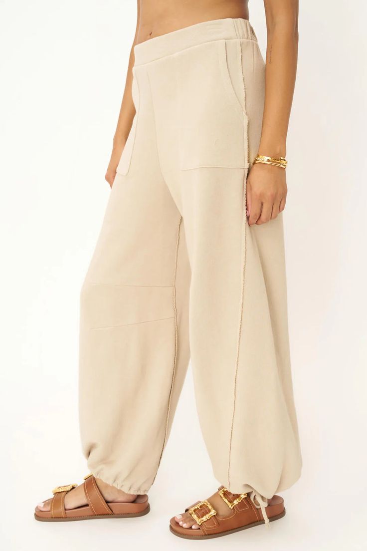 FINAL SALE - NO RETURNS. Feel free to email us at hello@shopmaude.com regarding sizing, fit, or our return policy. We just made the perfect pant. We'll take a bow.The Take A Bow Tie Bottom Parachute Pant is one you'll always find an excuse to wear. This pant features an elasticized high waistband, side pockets, raw edge details throughout, and tie ankle details to create the perfect parachute silhouette. 70% Cotton30% Rayon Care Instructions: Machine wash cold.Wash inside out with similar colors Parachute Silhouette, Parachute Pant, Levis Outfit, Perfect Pant, Lifestyle Trends, Straight Dress, Pocket Jacket, Raw Edge, Hazelnut