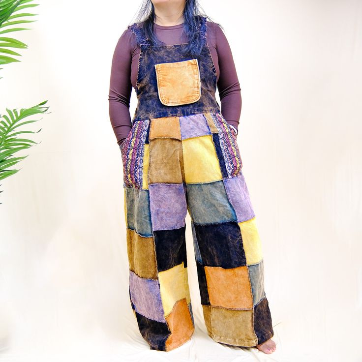 Women Corduroy Jumpsuit, Handmade Boho Hippie Overalls, Multicolor Wide Leg Rompers, Plus Size Patchwork Jumpsuit, 90s Style Baggy Jumpsuit This handmade corduroy jumpsuit is the perfect addition to your boho hippie wardrobe. With its patchwork design and multicolored accents, it's sure to make a statement. The wide leg and baggy fit give off a 90s vibe, making it both retro and fashionable. Handmade corduroy jumpsuit with patchwork accents - Unisex dungaree style with a boho hippie flair - Multicolored design with wide legs for a 90s-inspired look Made from sustainable cotton, this jumpsuit is both cute and eco-friendly. Plus, the tie back adds an elegant touch while the hook-and-loop closure makes it easy to put on and take off. Key . Made from sustainable cotton for conscious fashion - Casual Cotton Jumpsuit With Patchwork, Casual Cotton Jumpsuits And Rompers With Patchwork, Casual Cotton Jumpsuit And Romper With Patchwork, Casual Multicolor Patchwork Jumpsuits And Rompers, Cotton Overalls For Festivals, Cotton Festival Overalls And Rompers, Cotton Overall Jumpsuits And Rompers For Festival, Cotton Overall Jumpsuit For Festival, Cotton Hippie Style Overalls