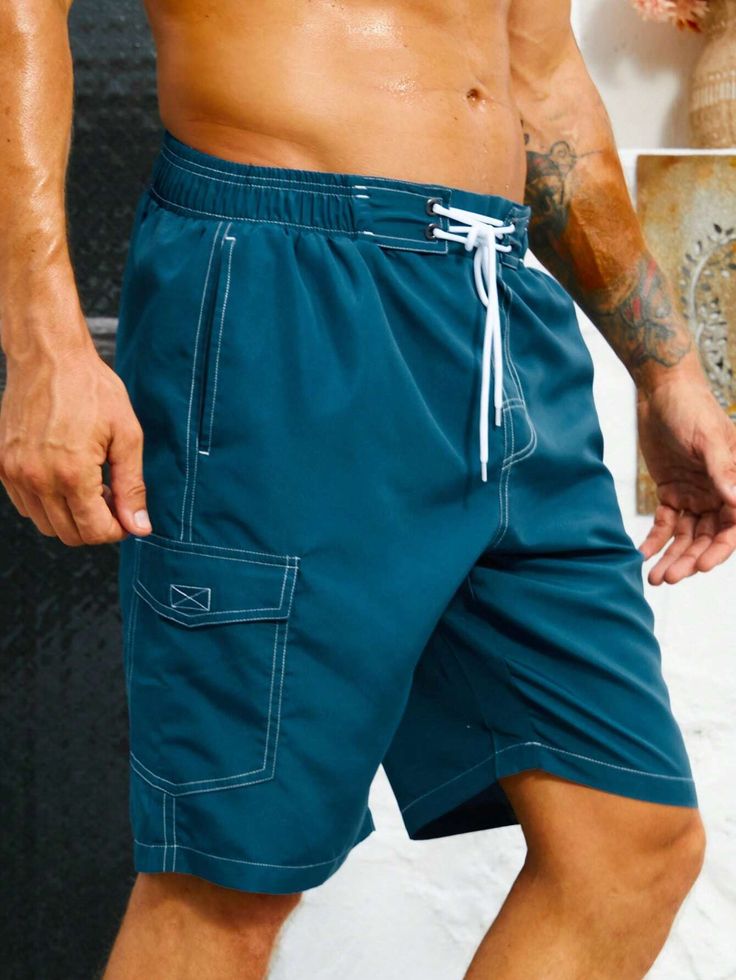 Stay organized and stylish with our Flap Pocket Swim Trunks. These swim trunks feature convenient flap pockets, providing storage for your essentials while on the beach or at the pool. The waistband offers a comfortable fit, and the quick-drying fabric ensures optimal comfort in and out of the water. Features: Color: Blue Pattern Type: Plain Details: Drawstring, Pocket Type: Bottoms Bottom Type: Shorts Fabric: Non-Stretch Care Instructions: Machine wash, do not dry clean Body: Lined Sheer: No Si Beach Cargo Shorts For Summer, Outdoor Bottoms With Pockets For Beach Season, Summer Sports Shorts With Cargo Pockets, Summer Beach Bottoms With Cargo Pockets, Beachwear Swimwear With Built-in Shorts For Outdoor, Casual Solid Swim Trunks With Side Pockets, Summer Bottoms With Pockets For Outdoor Activities, Beachwear Shorts For Outdoor Beach Activities, Summer Nylon Swim Trunks With Side Pockets