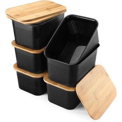 four black plastic containers with bamboo lids