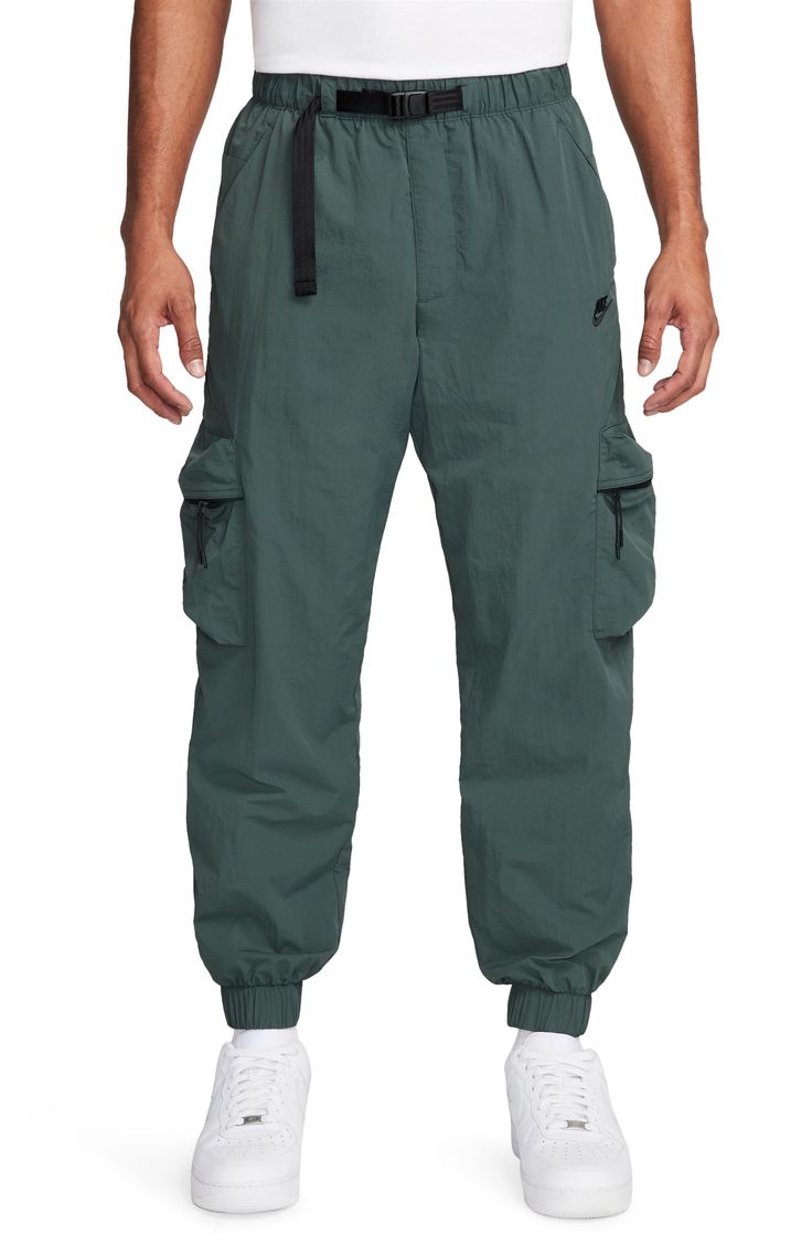 Lightweight, water-repellent nylon brings all-activity comfort to cargo pants that are cut with room to move and fitted with secure pockets for stowing your essentials. 29" inseam; 11" leg opening; 12 1/2" front rise; 16 1/2" back rise (size Medium) Elastic waist with integrated belt Front slant pockets; coin pocket; back zip pocket; cargo zip-patch pockets Elastic cuffs Water repellent Lined 100% nylon Machine wash, tumble dry Imported Techwear Parachute Pants With Functional Pockets For Outdoor Activities, Functional Hiking Bottoms With Cargo Pockets, Nylon Techwear Pants With Multiple Pockets, Urban Parachute Pants For Outdoor Activities, Green Athleisure Cargo Pants For Outdoor Activities, Green Athleisure Cargo Pants For Outdoor, Functional Pants With Cargo Pockets For Outdoor Activities, Nylon Sportswear Cargo Pants For Sports, Sportswear Nylon Cargo Pants For Sports